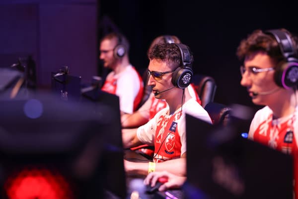 6ax, a professional League of Legends coach, competing with his team at an esports tournament.